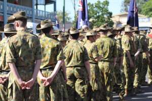 Australian soldiers stand and wait for Anzac parade
