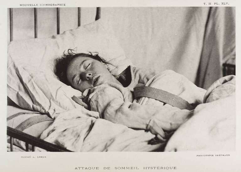 Female patient in straight jacket