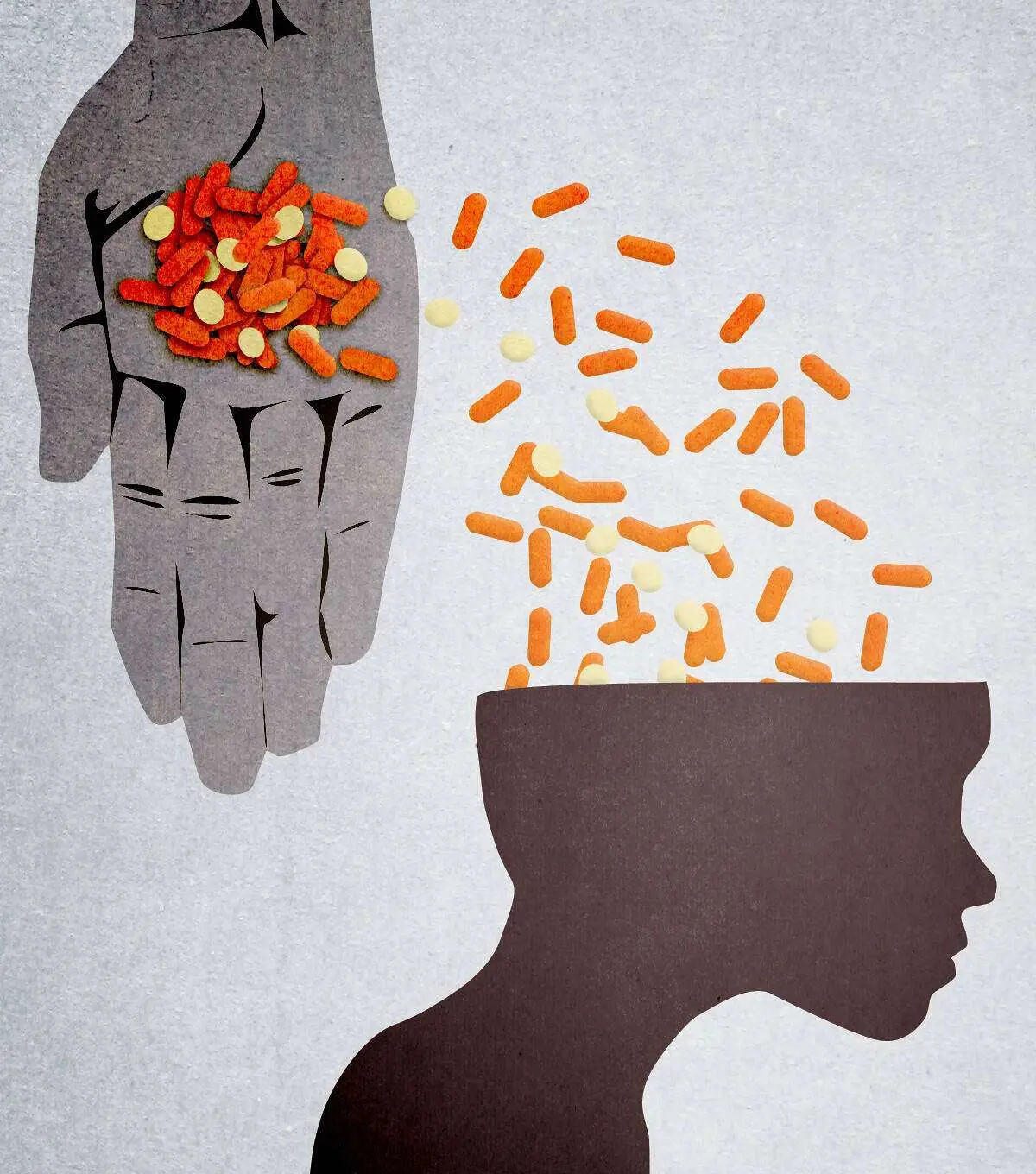 A hand pouring pills into a person's head